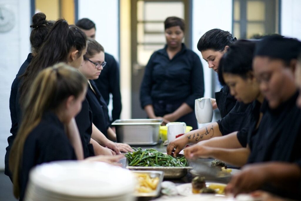 Students at IWH academy learning about catering
